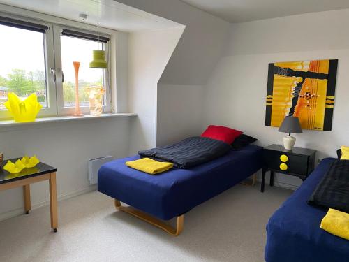 Posteľ alebo postele v izbe v ubytovaní Apartment med udsigt over Nordmors