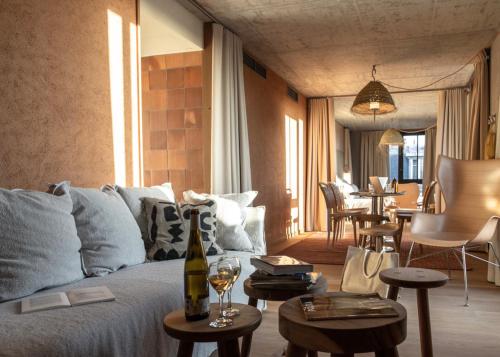 a living room with a couch and a table at MOB House in Saint-Ouen