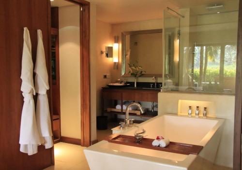 a bathroom with a sink and a mirror at Alila Diwa Goa - A Hyatt Brand in Majorda