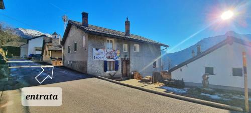 a house with a sign that says antioch next to a street at B&B Chalet Della Torre in Molare