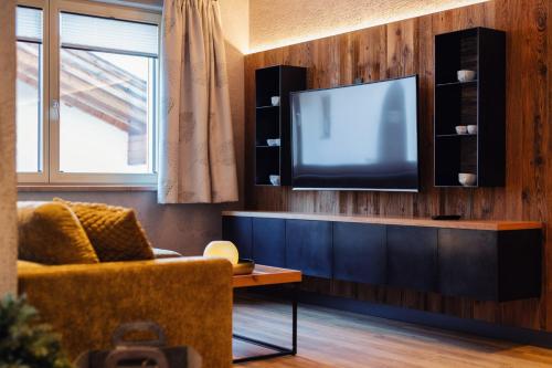 Télévision ou salle de divertissement dans l'établissement Die Reblaus