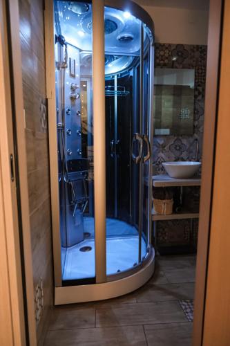 a glass shower in a bathroom with a sink at B&B Civico 35 in Chieti