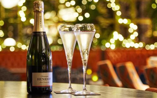 a bottle of champagne and two glasses on a table at The Montenotte Hotel in Cork