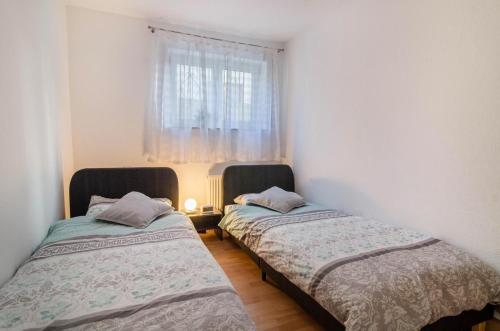 מיטה או מיטות בחדר ב-Apartment Neunzehn