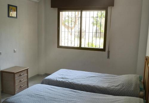 Postel nebo postele na pokoji v ubytování Villa Andaluza