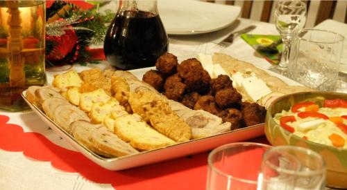 a tray of food on top of a table at Pensiunea Ardelean in Vadu Izei