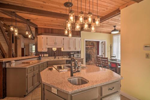 a kitchen with a sink and a counter top at Tranquil Smoky Mountain Cabin with Porch and Fire Pit in Newport