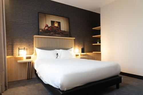 Una cama o camas en una habitación de ibis Styles Arras Centre