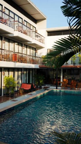 a swimming pool in front of a building at Z&Z House in Rawai Beach