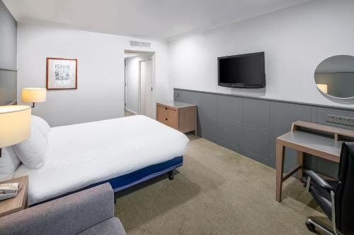 a hotel room with a bed and a tv at Holiday Inn Hull Marina by IHG in Hull
