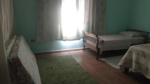 Cama o camas de una habitación en Hospedaria Namastê