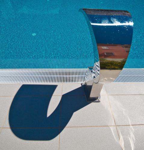 a reflection of a swimming pool at House Novalia in Novalja