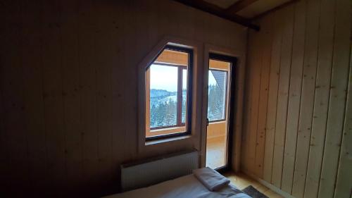 a room with a window and a bed in it at SPA Resort Villa Sofia in Yablunytsya