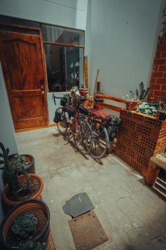a group of bikes parked in a room with a door at The Chusay Rooftop in Cusco