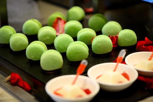 a bunch of green tennis balls on a table at Orient-Anyi international Hotel in Beijing