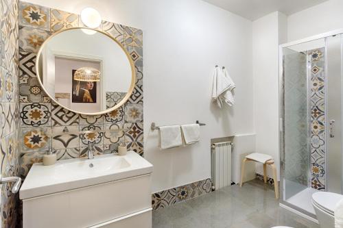 a bathroom with a sink and a mirror at Villa U Marchisi B&B in Scicli