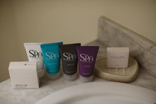 a group of four products sitting on top of a toilet at Galgorm in Ballymena