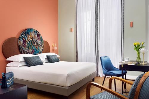 Una cama o camas en una habitación de Dimora ai Fori - Guest House