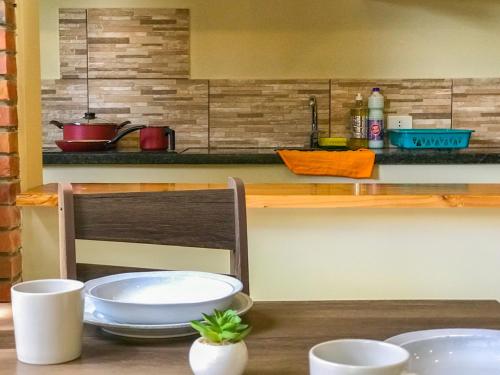 Kitchen o kitchenette sa Aparthotel Los Laureles