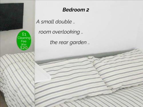 a small double room overloading the rear garden bed at Victorian Terrace Old Stoke - With Self Check In and Free Parking - Rooms at ipswichdigs in Ipswich