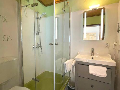 a bathroom with a shower and a sink at Thannheimer Häusl in Oberstdorf