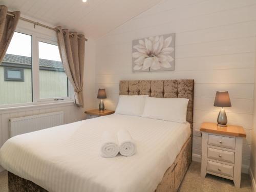 Säng eller sängar i ett rum på Lodge 4 - Glendoig