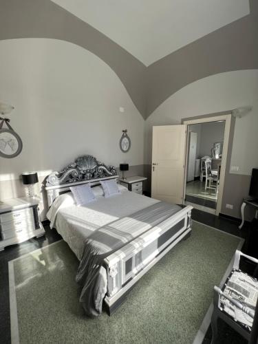 a bedroom with a large bed in a room at B&B Villa Prestigio in Novi Ligure