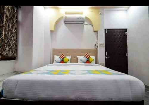 a bedroom with a large bed in a room at Lake haus home stay enchanting lake breeze view in Udaipur