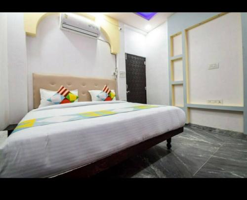 a bedroom with a large bed in a room at Lake haus home stay enchanting lake breeze view in Udaipur