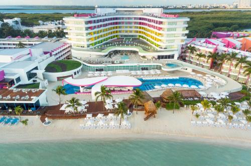 an aerial view of a resort on the beach at The Tower by Temptation Cancun Resort - All Inclusive - Adults Only in Cancún