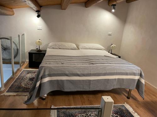 a bedroom with a large bed in a room at Profumo D'arancio B&B a Pedalino in Casa Criscione