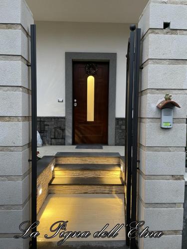 a door leading into a house with a hallway at La Pigna dell'Etna in Nicolosi