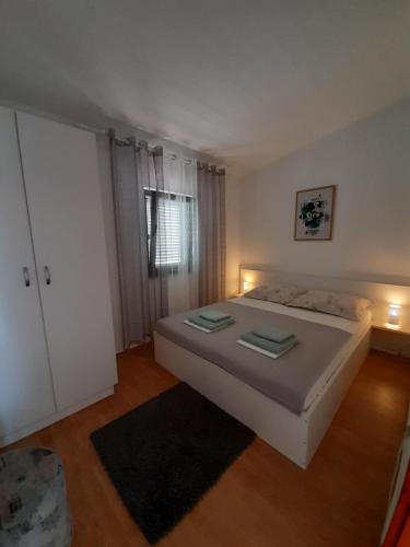 Postel nebo postele na pokoji v ubytování APARTMAN RITA