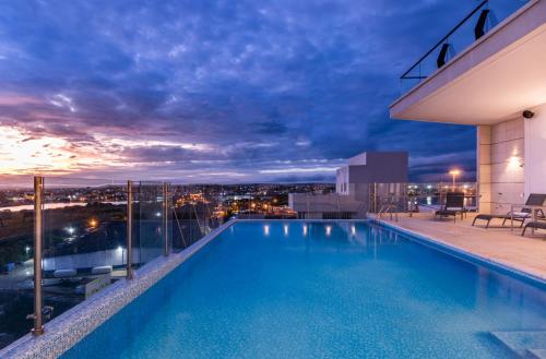 a pool on the roof of a building with a view at Holiday Inn Express Cartagena Manga by IHG in Cartagena de Indias
