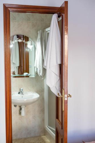 a bathroom with a sink and a mirror at San Antón in Cazorla