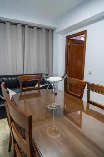 a dining room with a table with chairs and a couch at San Antón in Cazorla