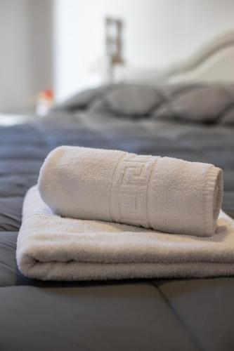 two towels sitting on top of a bed at San Antón in Cazorla