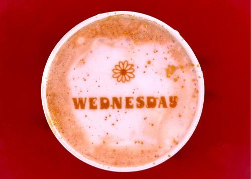 a cup of coffee with the word wednesday on it at Taos Valley Lodge in Taos