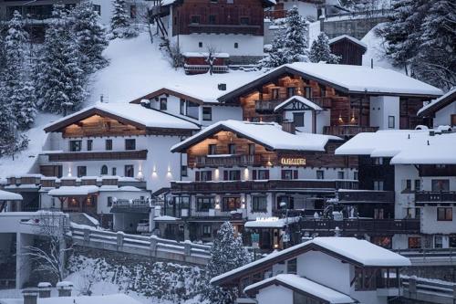 a group of buildings with snow covered roofs at Das Elisabeth in Sankt Anton am Arlberg
