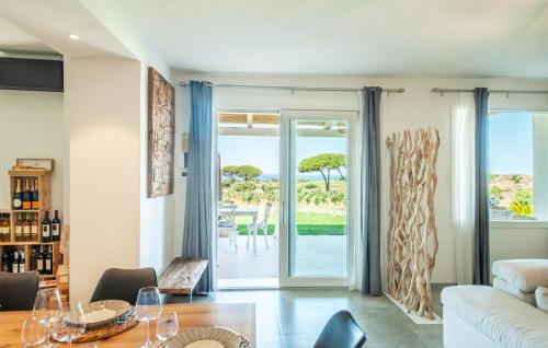 a living room with a view of the ocean at Bellimpiazza - Villa vista mare con piscina in Sorso