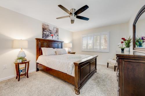 a bedroom with a bed and a ceiling fan at Sun City's Charmer in Sun City