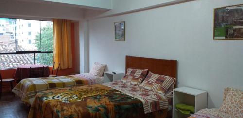 Postel nebo postele na pokoji v ubytování Kaboka Cusco Hospedaje Familiar