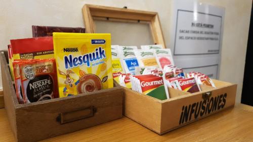 a box filled with different types of snacks on a table at Abadía Burgos Camino Santiago in Burgos