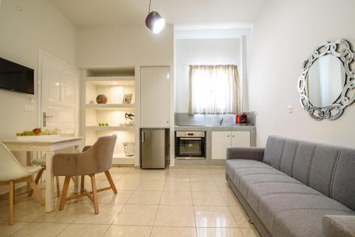 Kuchyň nebo kuchyňský kout v ubytování De_naxia Suites