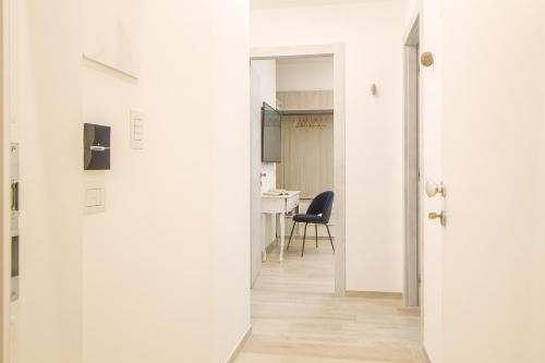 an open door to a room with a table at Primopiano Luxury Accommodations in Vieste
