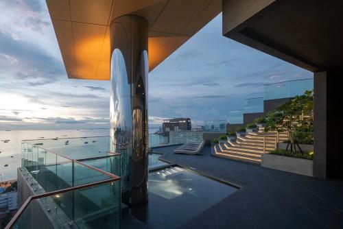 a view of a building with a view of the ocean at The Edge central pattaya in Pattaya Central