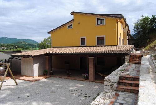 a house that is being built with a stone wall at B&B Pascale in Cusano Mutri
