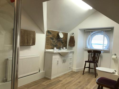 a bathroom with a sink and a window at The Haven in Holyhead