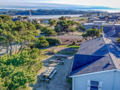 an aerial view of a house with a picnic table at Crows Coastal Cottage in Waldport