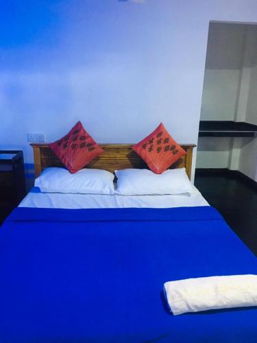 Postel nebo postele na pokoji v ubytování Himansa Homestay
